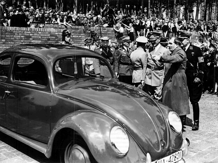 Adolf Hitler inspects one of the first Beetles during the inauguration of the Volkswagen factory